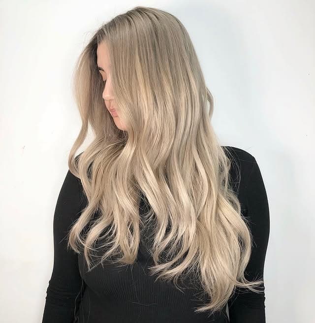 1. Long Layered Champagne Blonde Waves - Champagne Blonde Hair Color