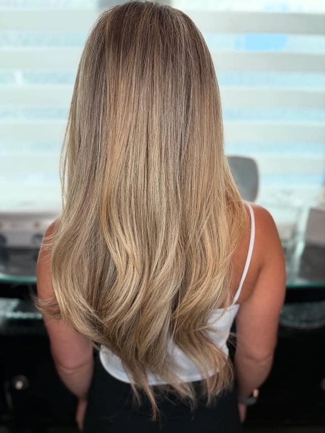 11. Long Champagne Blonde Layers with Soft Ends - Champagne Blonde Hair Color