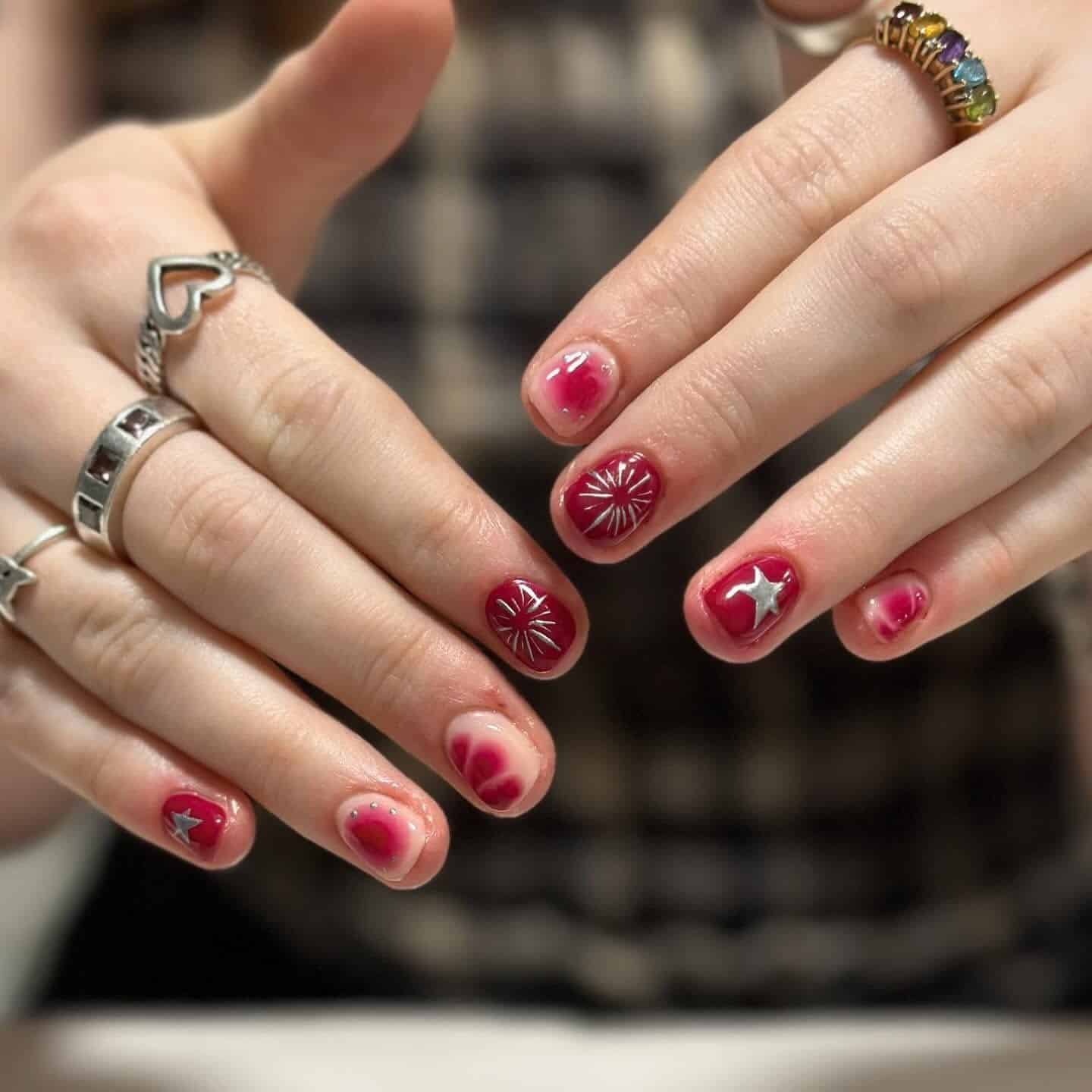 4. Berry Aura Short Nails with Silver Star Accents - short nail art ideas