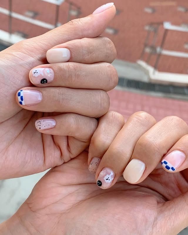 9. Minimalist Nude Short Nails with Blue Accent Art - short nail art ideas