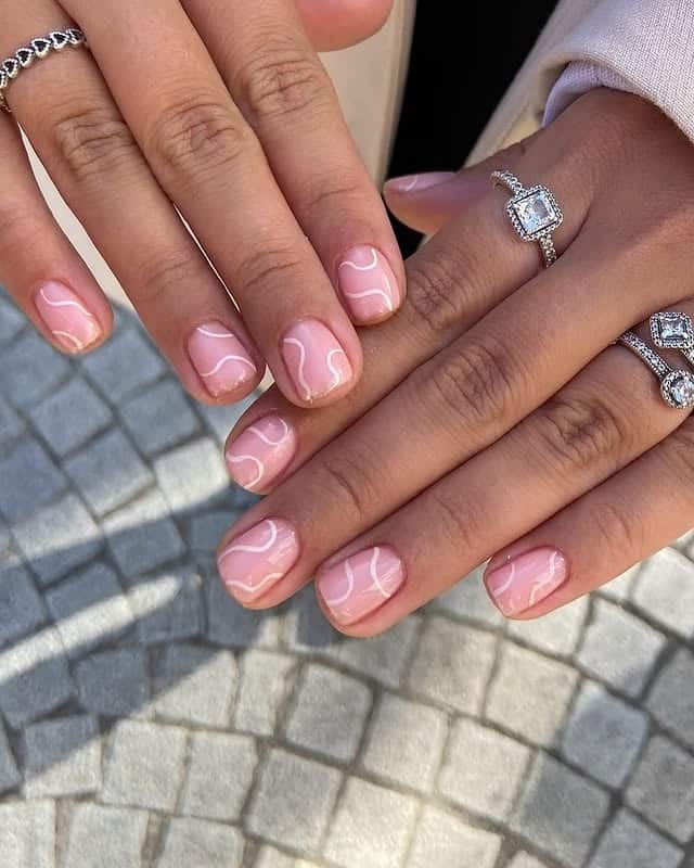 15. Soft Pink Swirl Short Nails with White Line Art - short nail art ideas