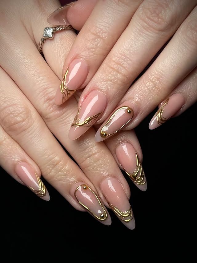 1. Nude Almond Nails with Gold Chrome Swirls - thanksgiving nail ideas