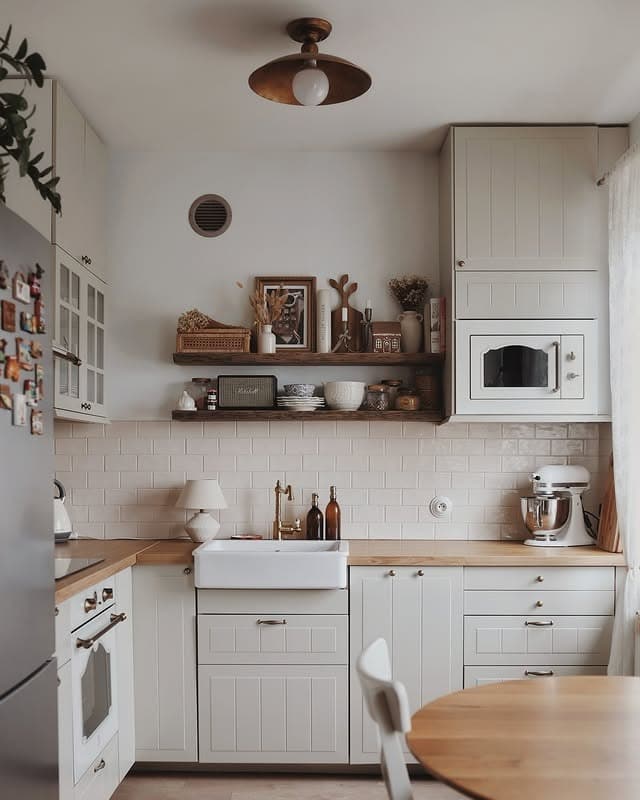 3. Cottage-Inspired White Kitchen with Natural Wood Accents - tiny kitchen ideas