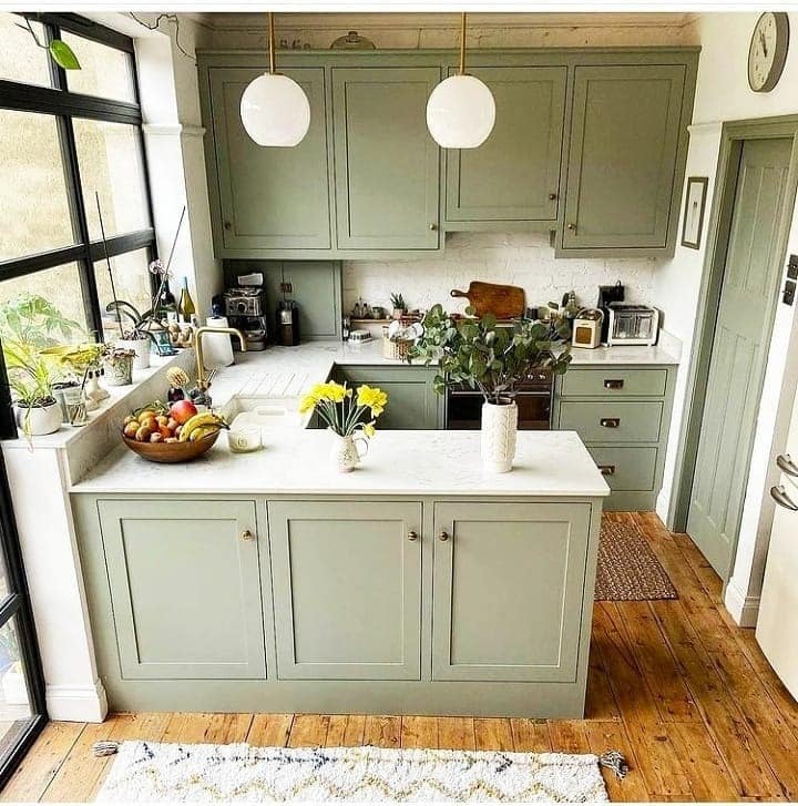 4. Sage Green Kitchen with Compact Island Storage - tiny kitchen ideas