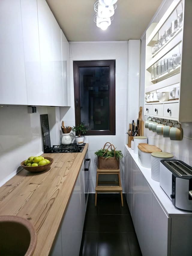 8. Minimalist White Galley Kitchen with Floating Shelves - tiny kitchen ideas