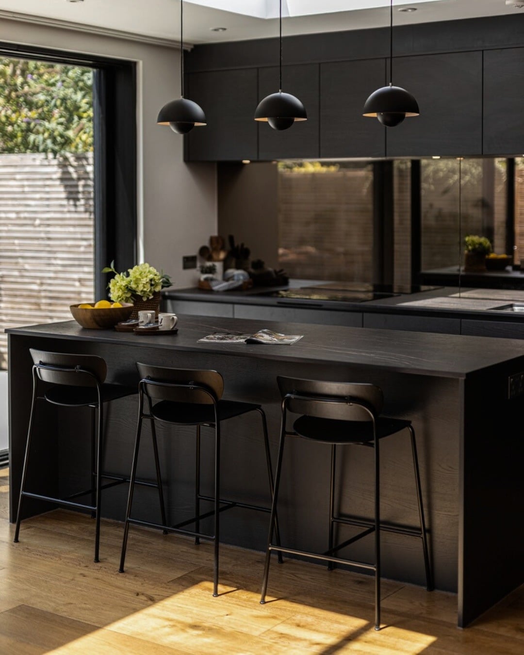 7. Black Oak Kitchen with Natural Wood Flooring - dark kitchen ideas