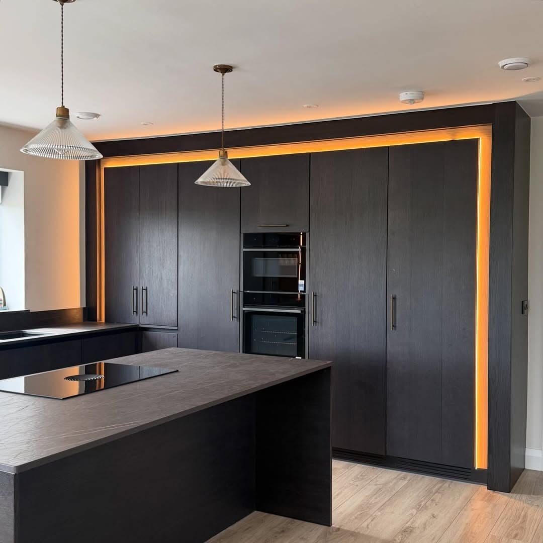 11. Black Oak Kitchen with Ambient LED Lighting - dark kitchen ideas