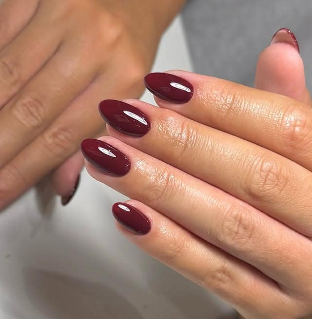 14. Burgundy Short Oval Nails - burgundy nail ideas