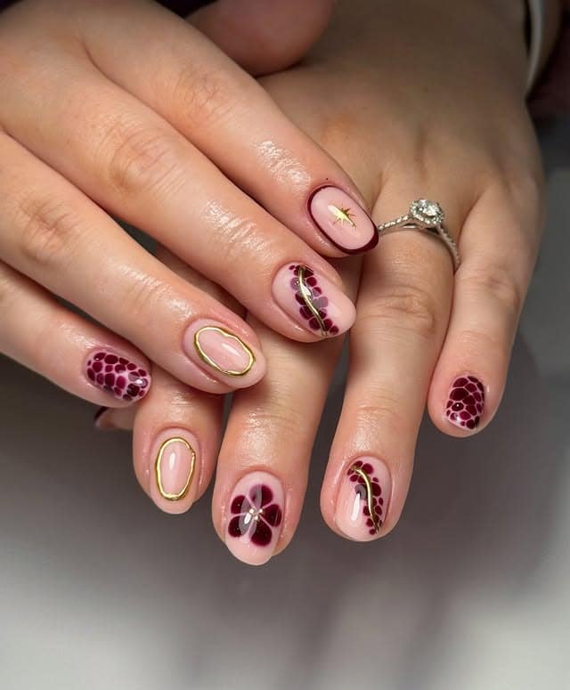19. Burgundy Botanical Accent Nails - burgundy nail ideas