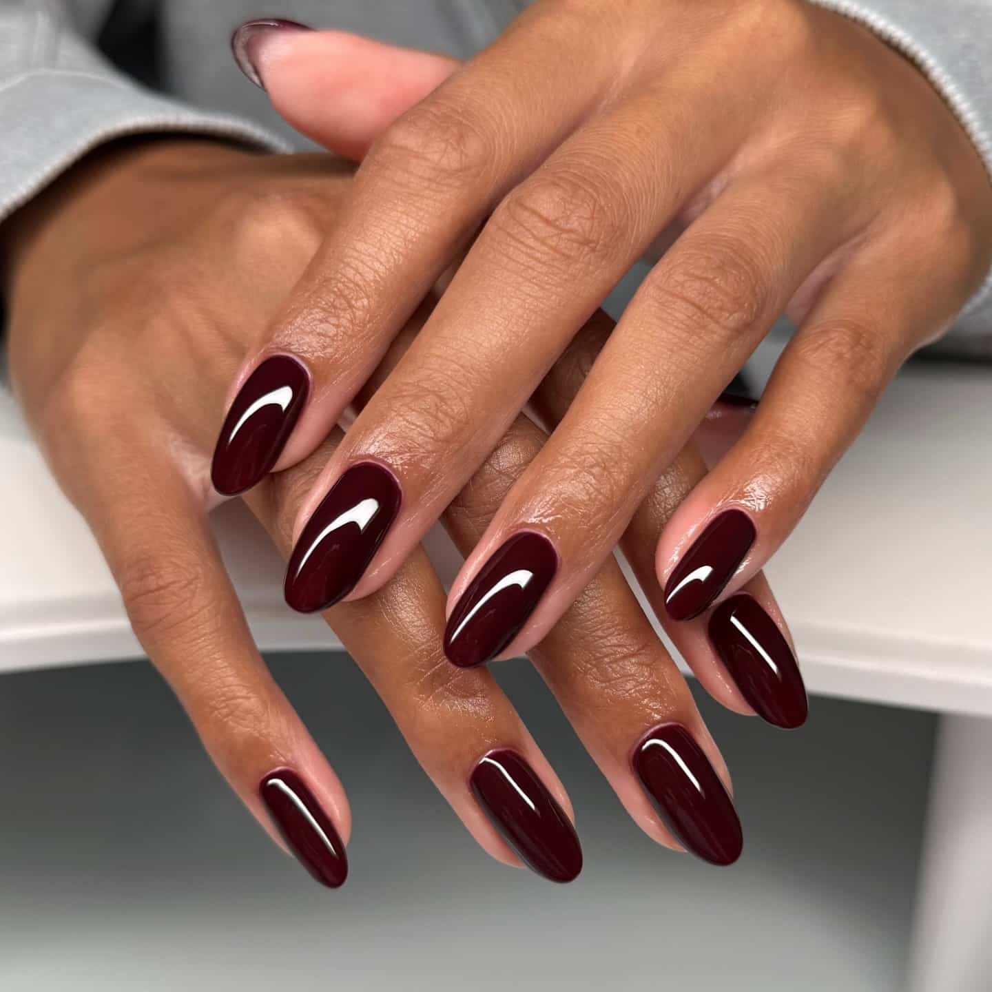 21. Glossy Burgundy Almond Nails - burgundy nail ideas