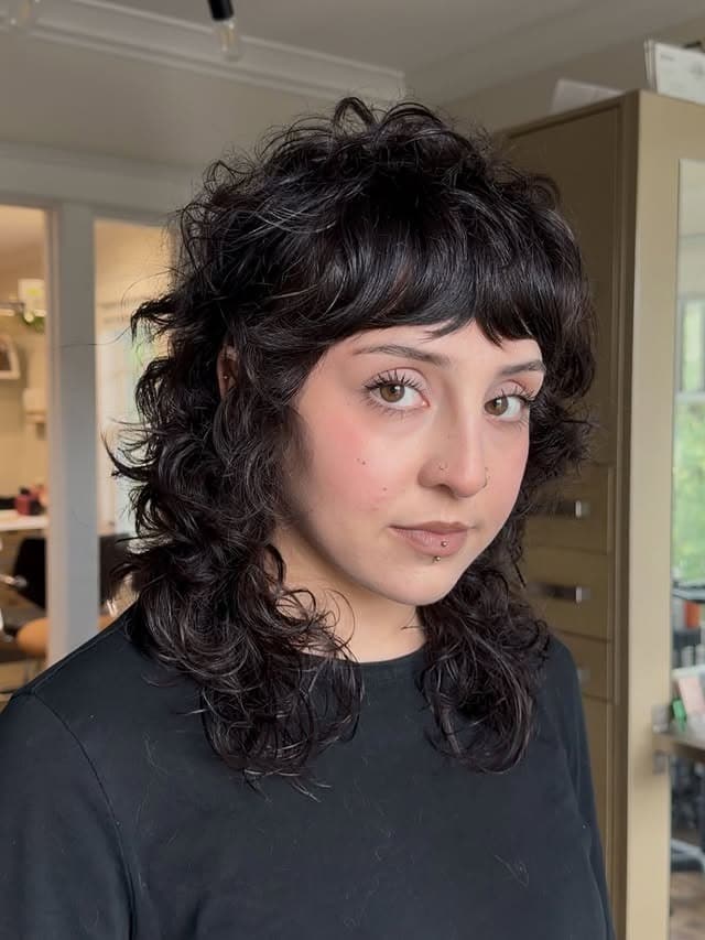 1. Curly Wolf Shag in Soft Black - Medium Length Shaggy Haircuts