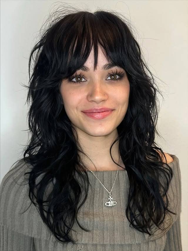3. Layered Shag with Jet Black Waves - Medium Length Shaggy Haircuts
