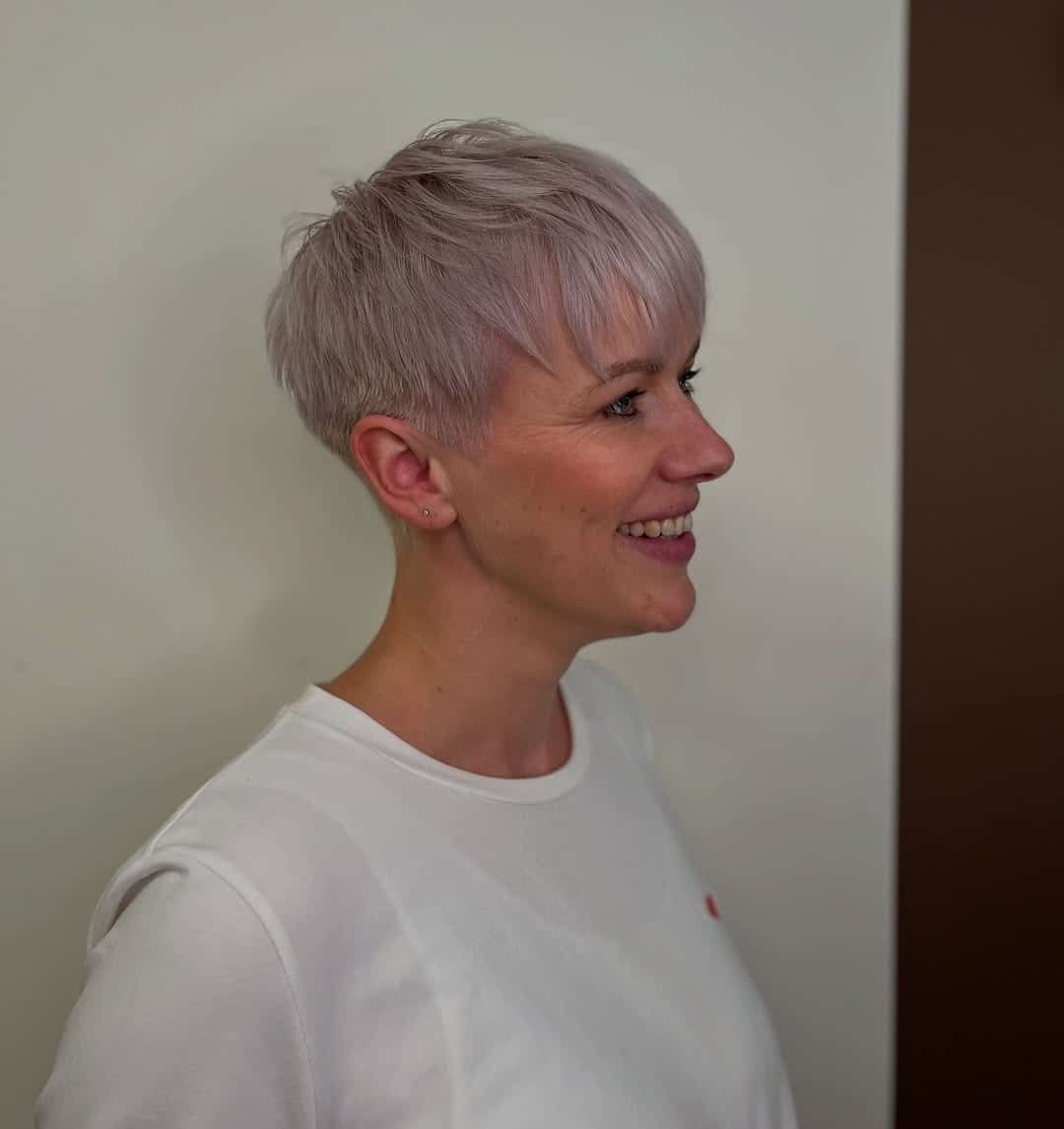5. Platinum Blonde Pixie Crop with Side-Swept Bangs - Short Pixie Haircuts For Women