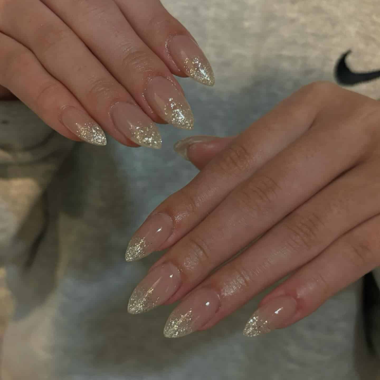 7. Champagne Glitter Clear Almond Nails - clear nail ideas