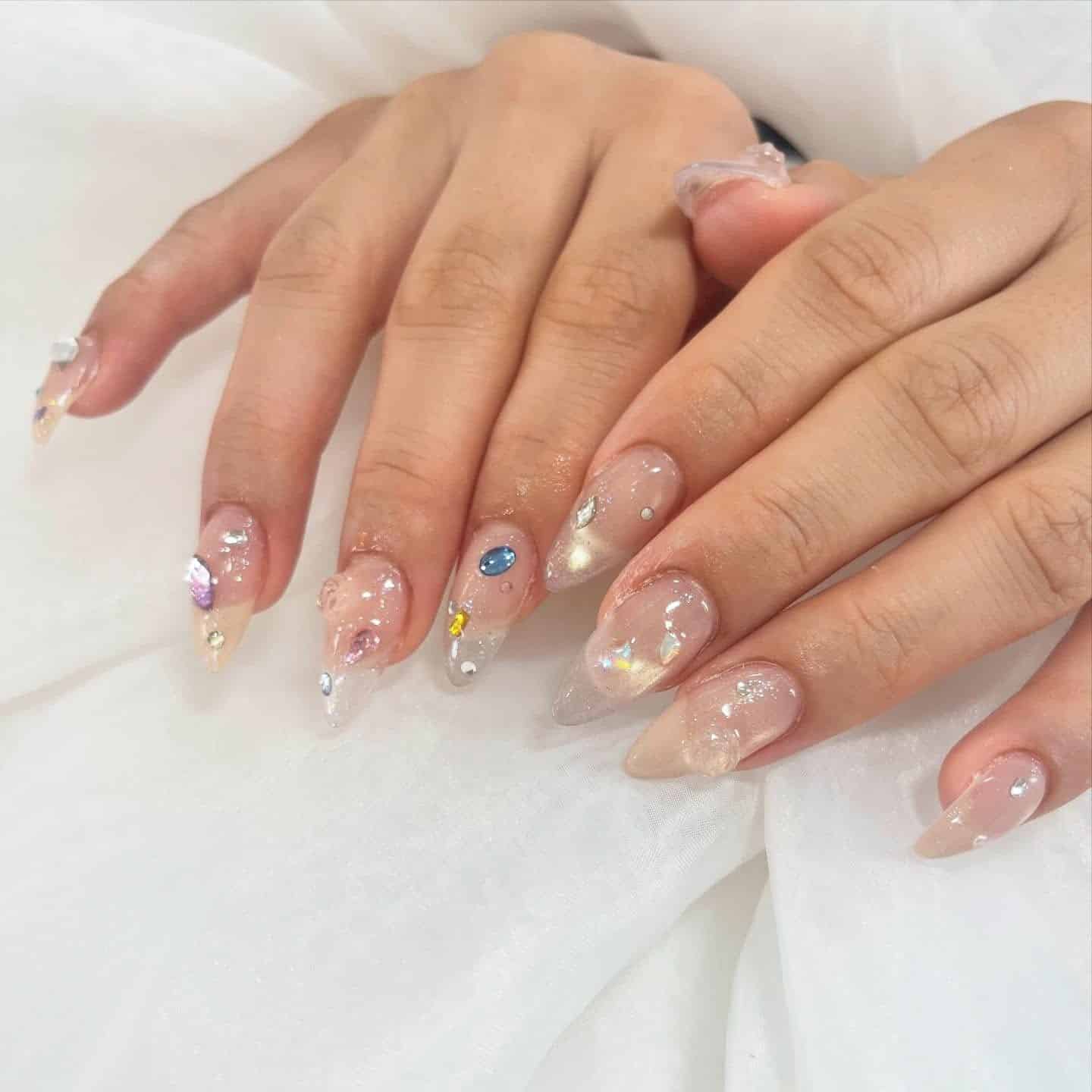 21. Iridescent Crystal Clear Stiletto Nails - clear nail ideas