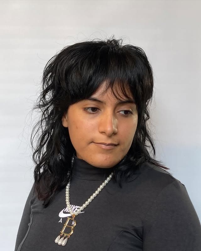 1. Textured Black Shag Mullet with Wispy Fringe - Shaggy Haircuts