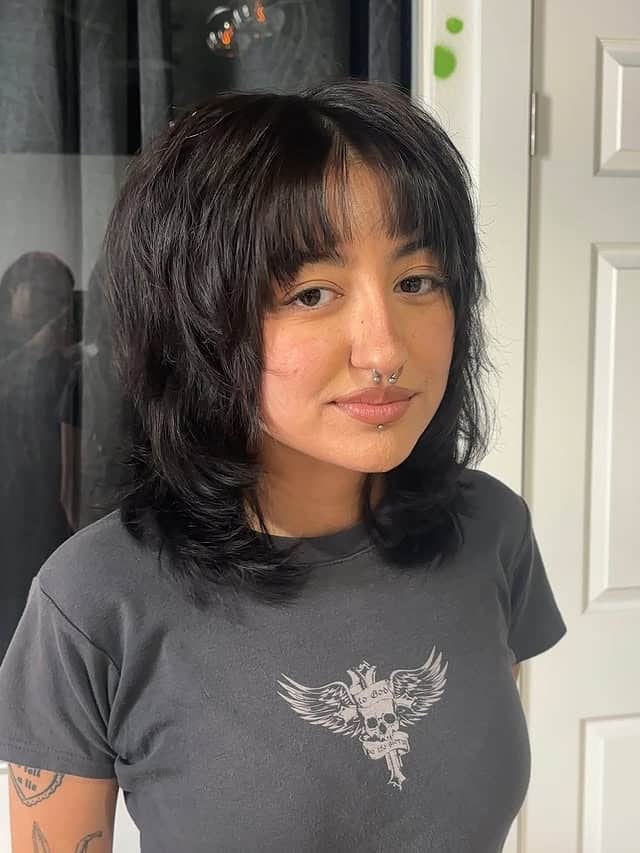 7. Rounded Black Shag with Full Fringe - Shaggy Haircuts