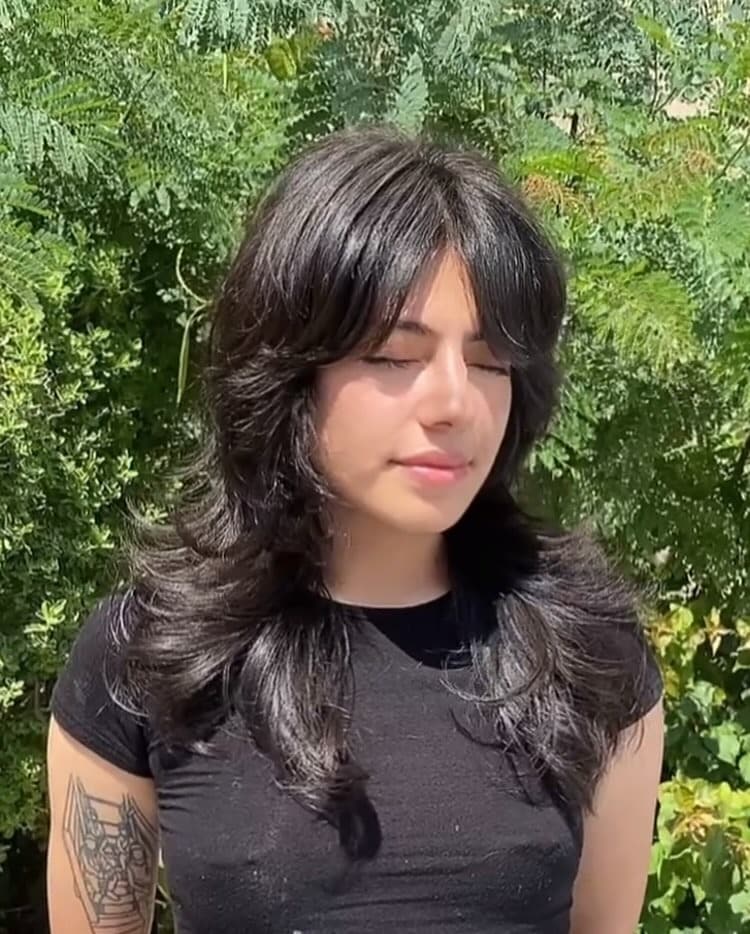 11. Jet Black Butterfly Shag with Curtain Bangs - Shaggy Haircuts