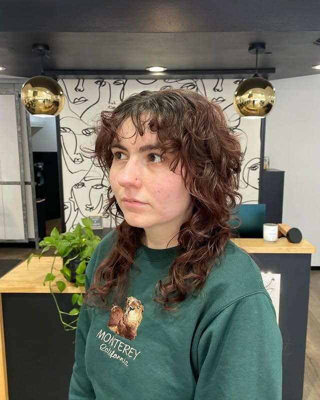 13. Auburn Curly Shag Mullet with Wispy Bangs - Shaggy Haircuts