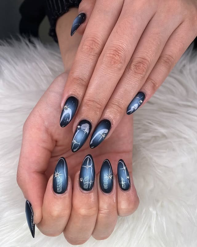 3. Midnight Blue Cat Eye Almond Nails - cool nail ideas