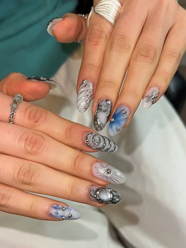 9. Silver Chrome Celestial Almond Nails - cool nail ideas
