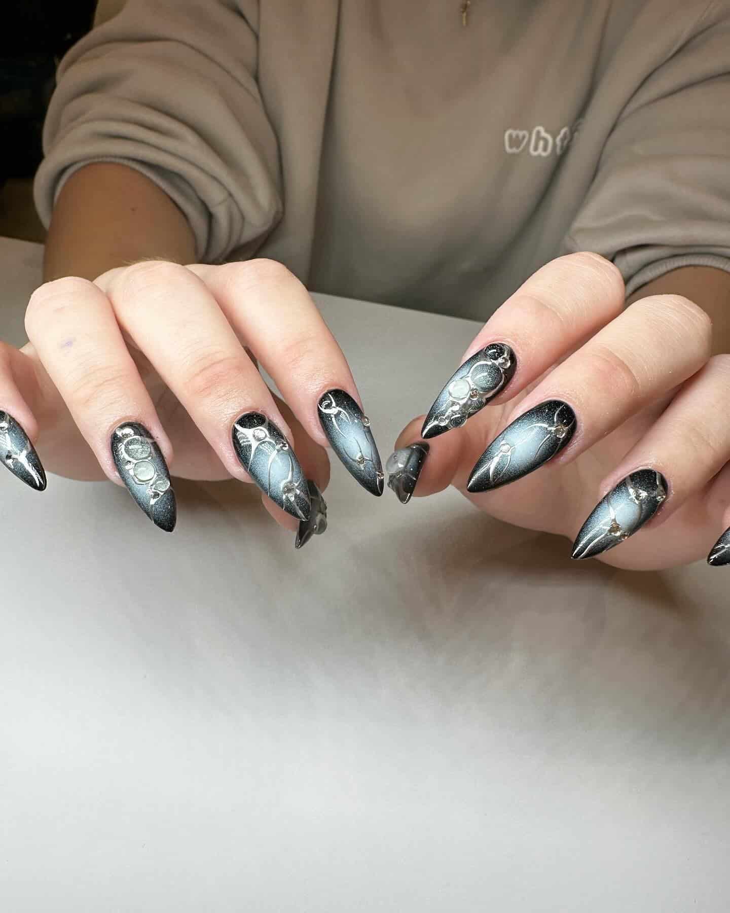 22. Black Chrome Galaxy Stiletto Nails - cool nail ideas