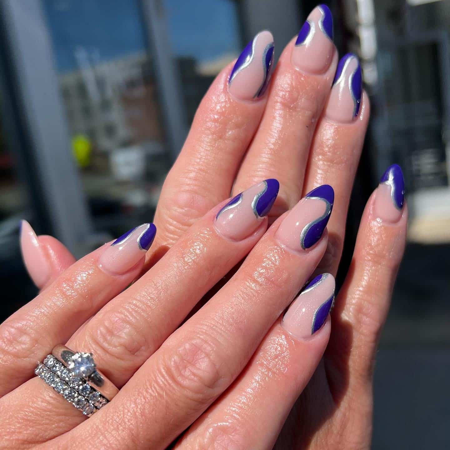 3. Purple Swirl Almond Dip Nails with Silver Accents - dip nail ideas