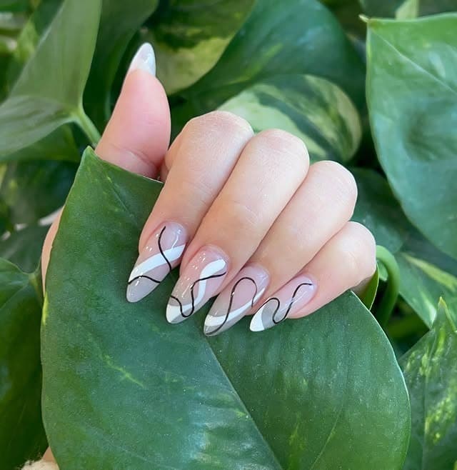 5. White French Tip Almond Dip Nails with Abstract Black Lines - dip nail ideas