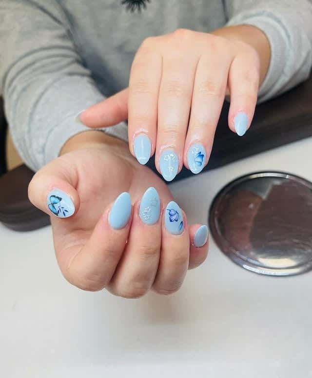 20. Baby Blue Floral Almond Dip Nails - dip nail ideas