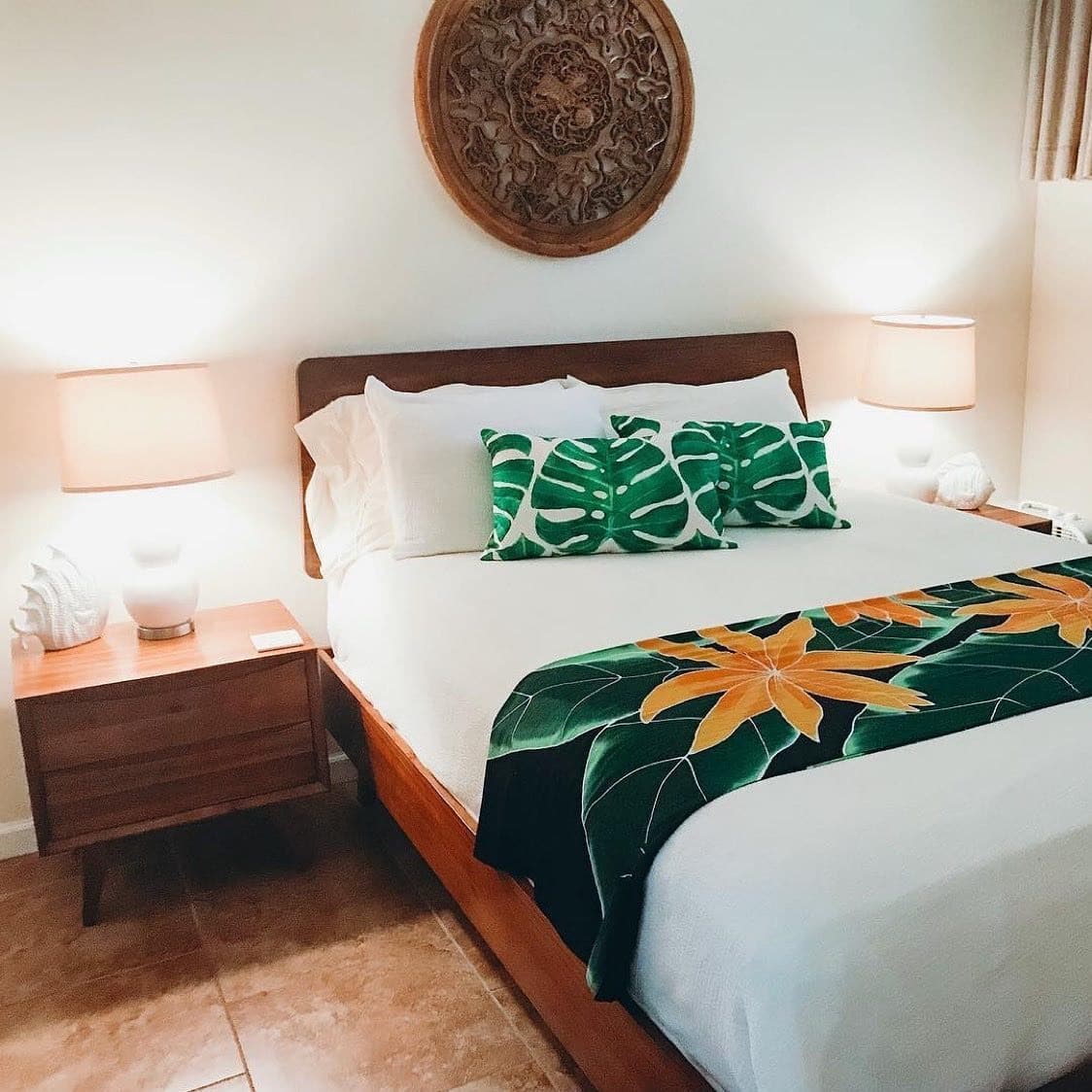 18. Tropical Botanical Bedroom with Emerald Green and Golden Orange Accents - hawaiian bedroom ideas