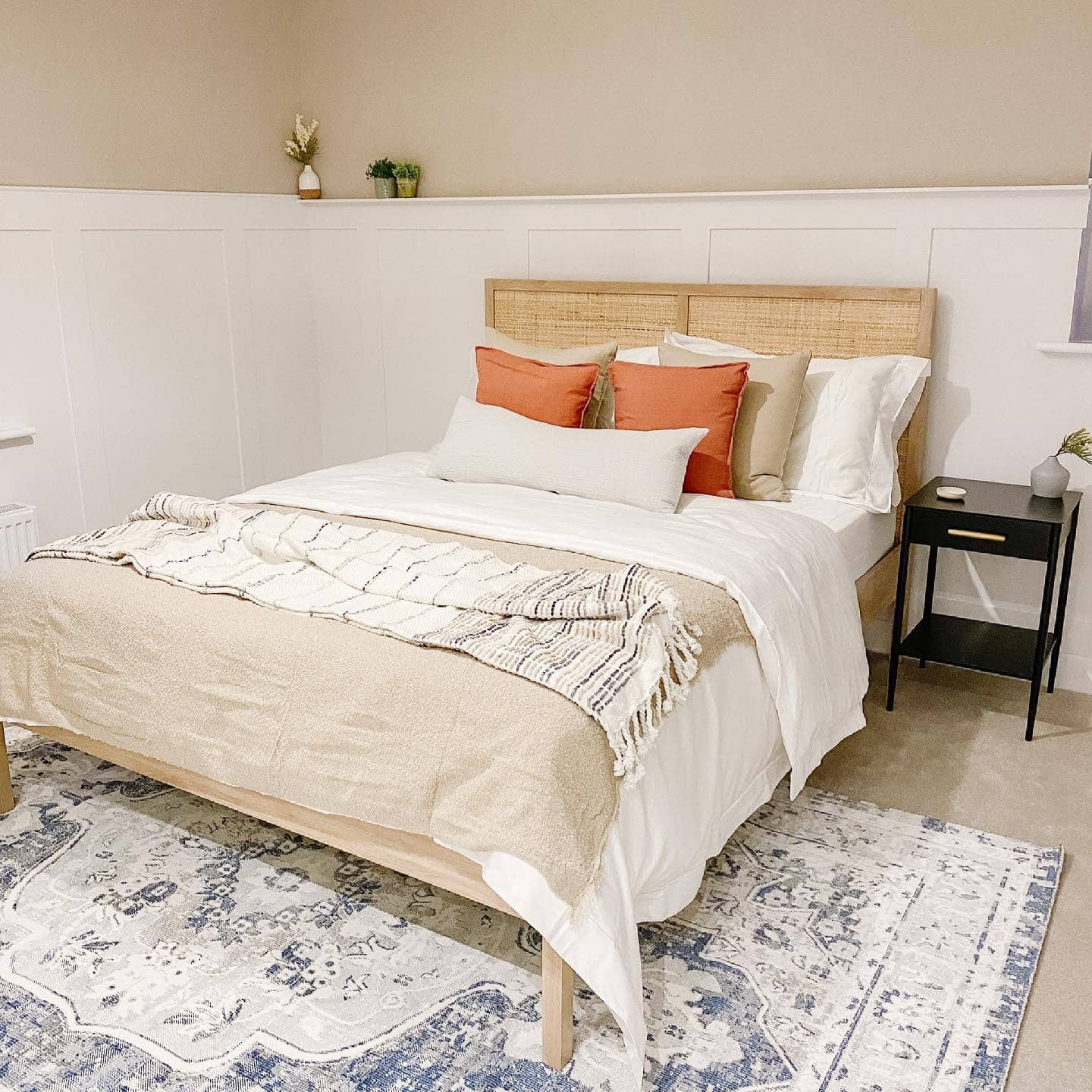 20. Coastal Cane Bedroom with Coral and Cream Color Palette - hawaiian bedroom ideas