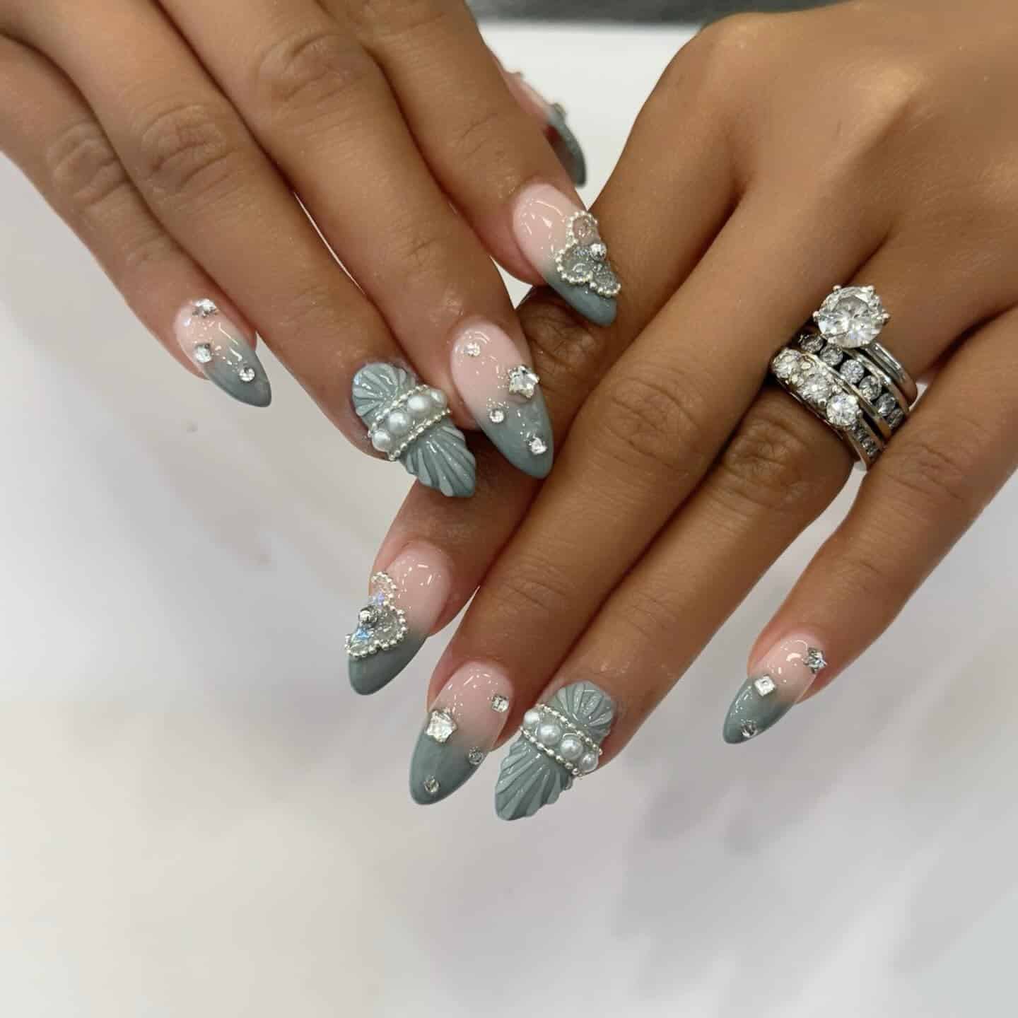 17. Sage Green Pearl Embellished Almond Nails - elegant nail ideas