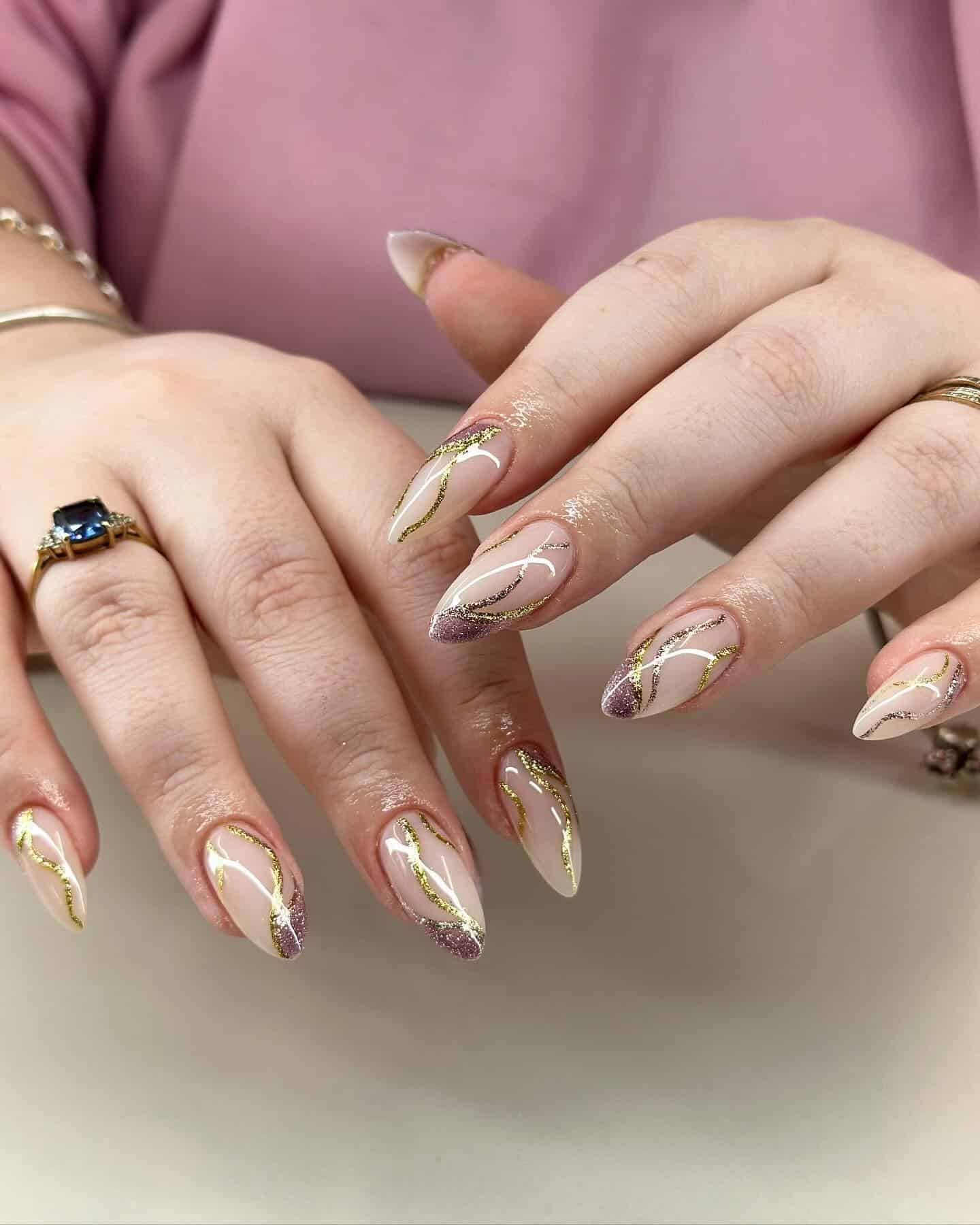 22. Champagne Glitter Swirl Almond Nails - elegant nail ideas