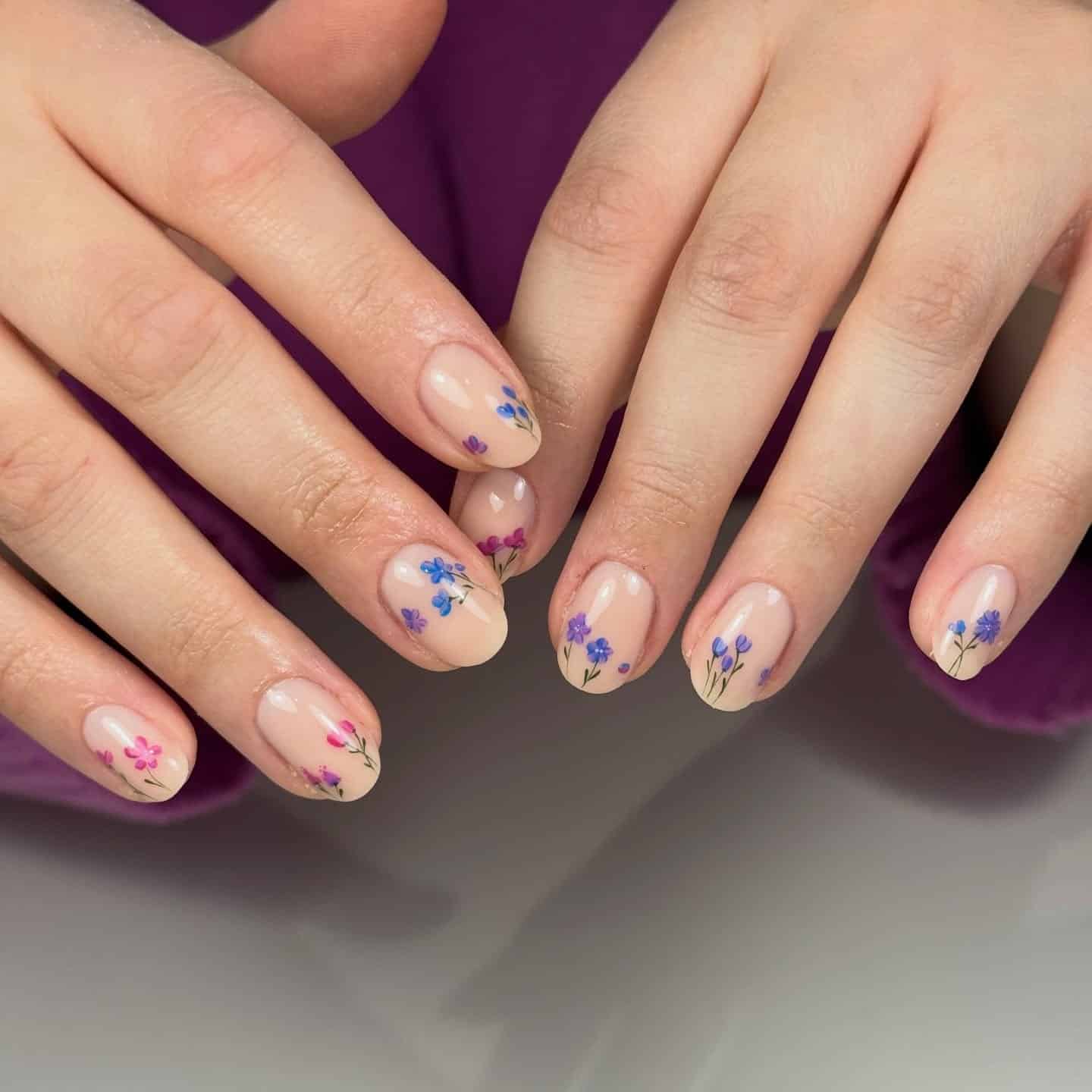 1. Delicate Wildflower Nails in Sheer Nude and Periwinkle Blue - floral nail ideas