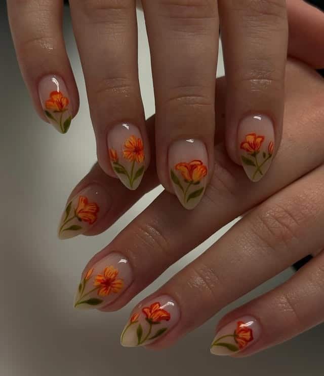 4. Orange Blossom Floral Nails on a Milky Nude Base - floral nail ideas
