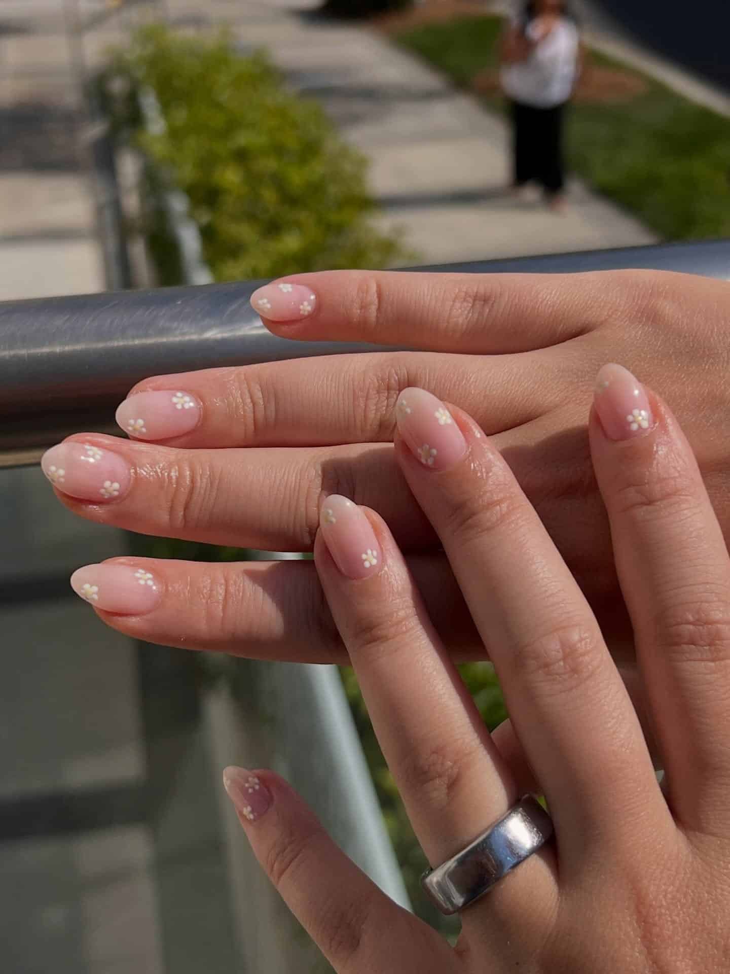 7. Minimal White Daisy Nails in Sheer Blush Pink - floral nail ideas