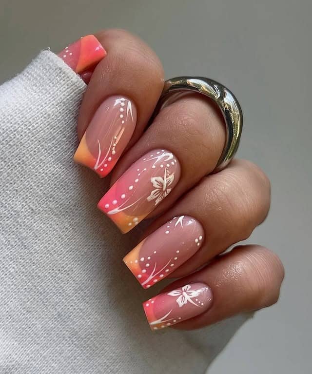 10. Sunset Gradient Floral Nails in Peach and Pink - floral nail ideas