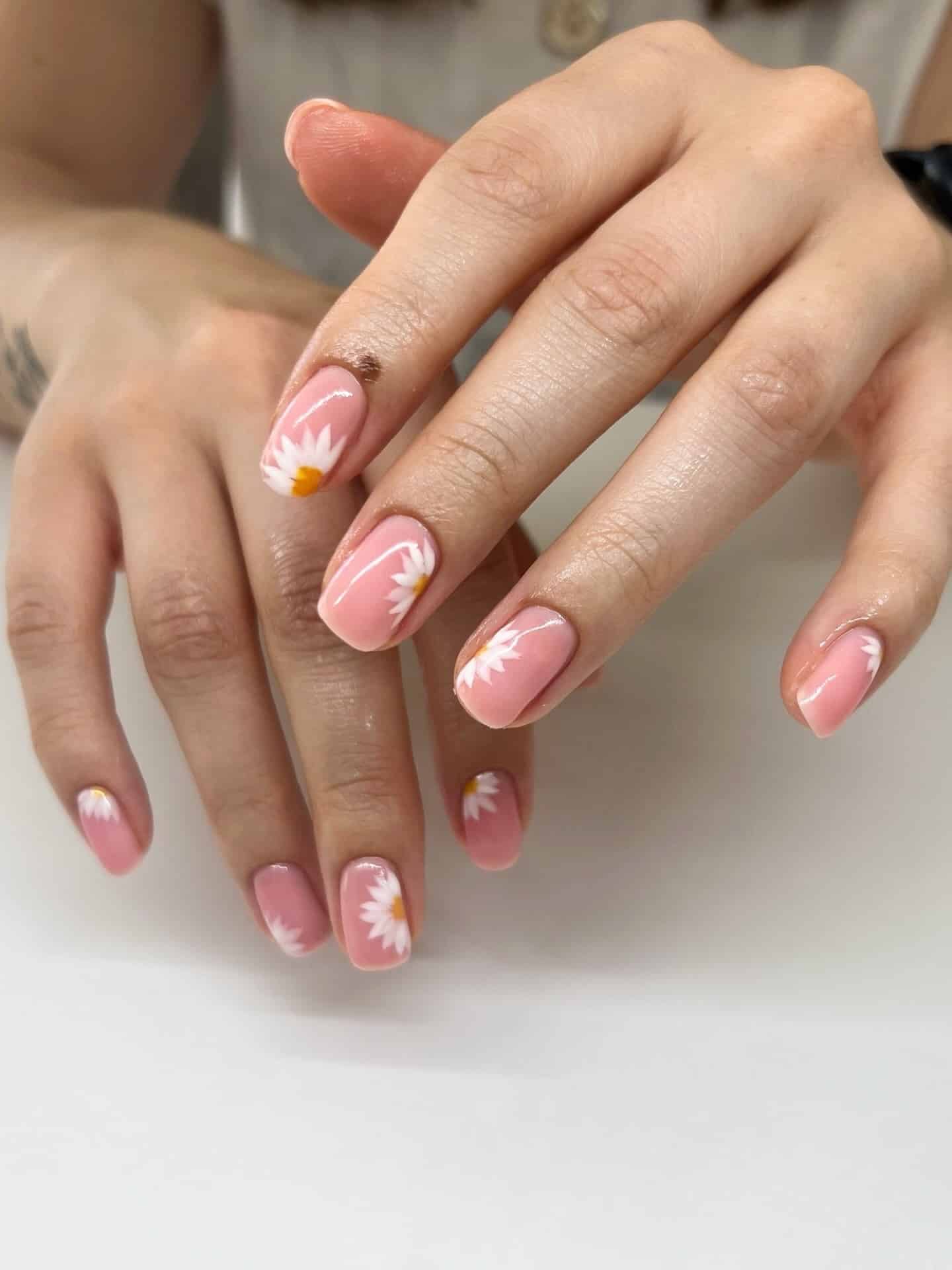 14. Orange Blossom Floral Nails on a Milky Nude Base - floral nail ideas