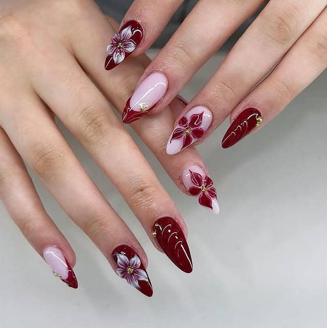 22. Burgundy Floral Stiletto Nails with Soft Pink Accents - floral nail ideas