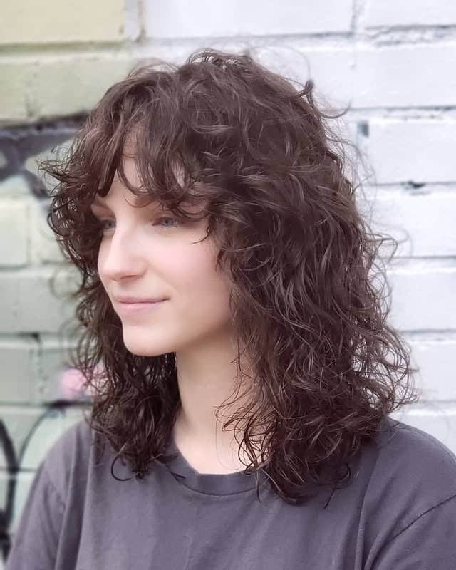 10. Dark Brunette Curly Shag with Curly Fringe - Choppy Shaggy Haircuts