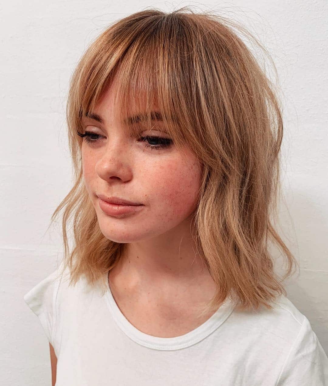 20. Sandy Blonde Shaggy Bob with Feathered Fringe - Shaggy Bob Haircuts