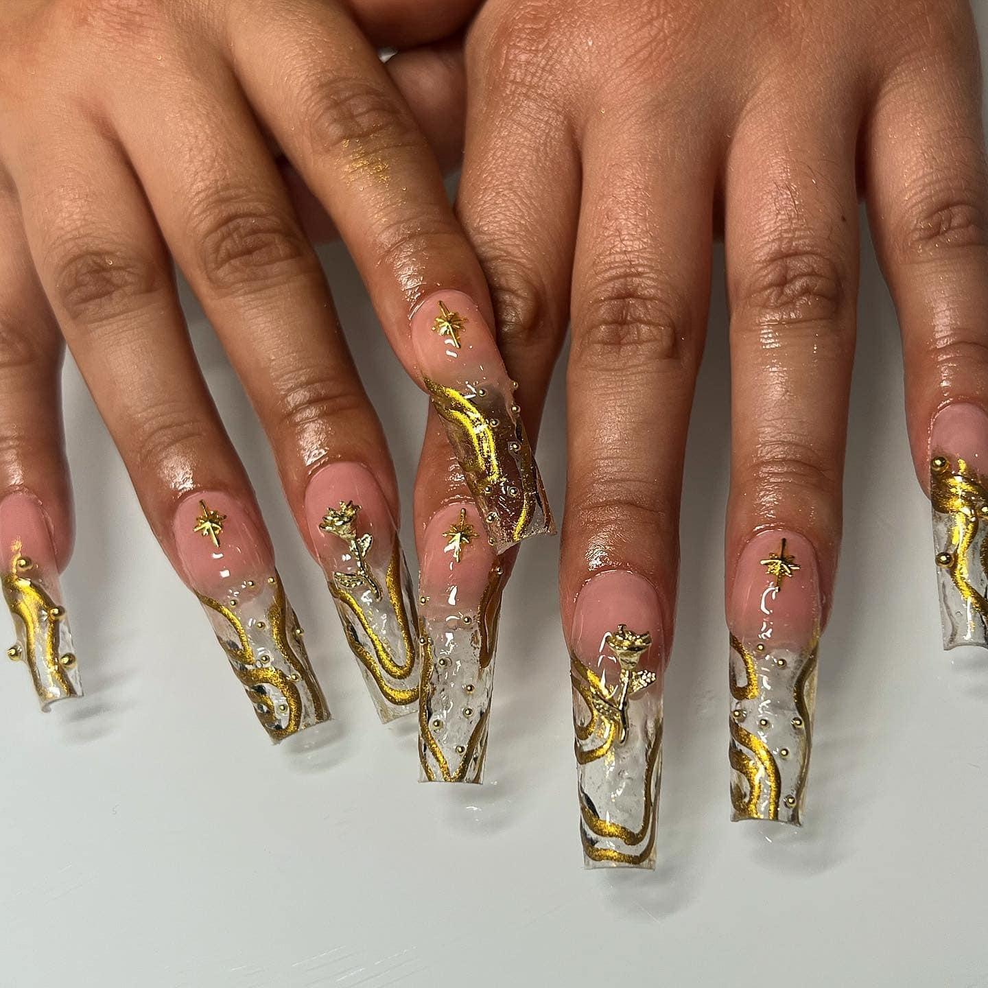 3. Gold Marble Coffin Nails with 3D Art - gold nail ideas