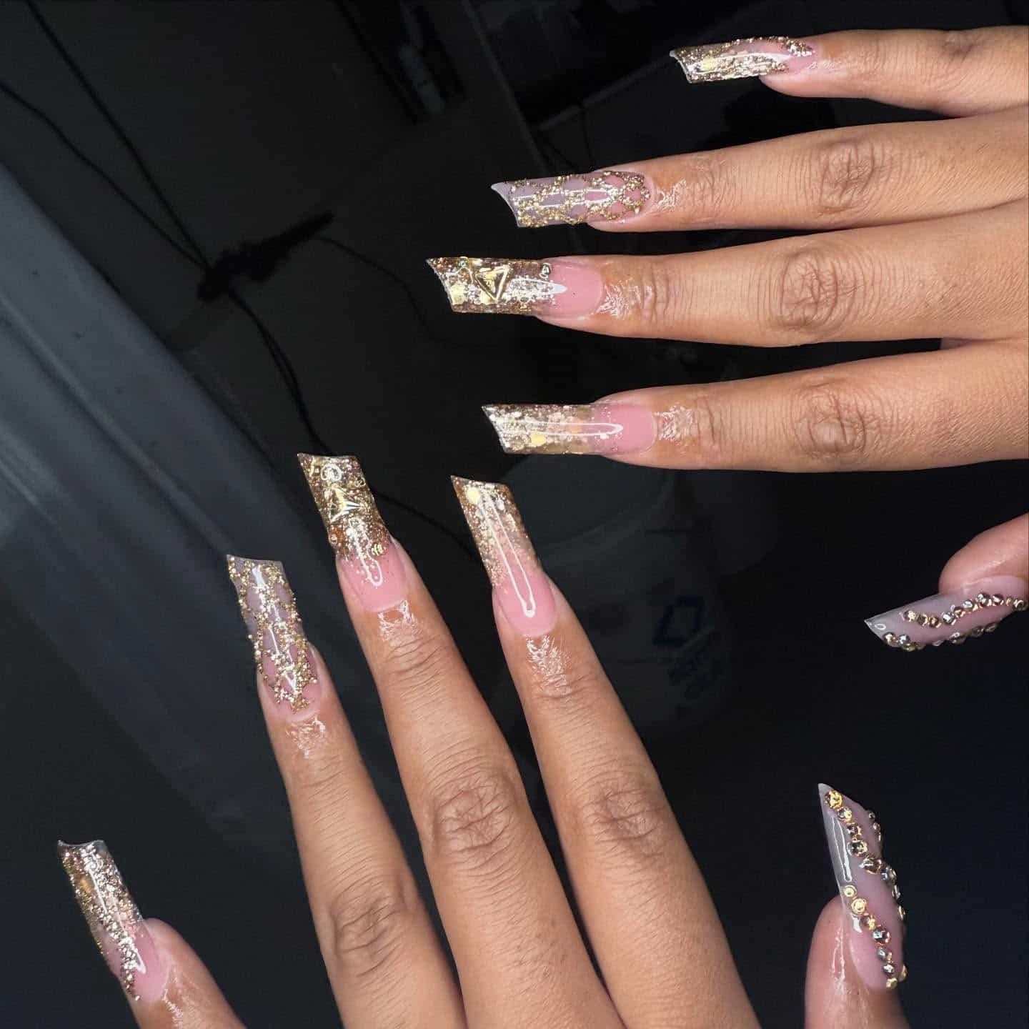 6. Gold Glitter Coffin Nails with Crystal Embellishments - gold nail ideas