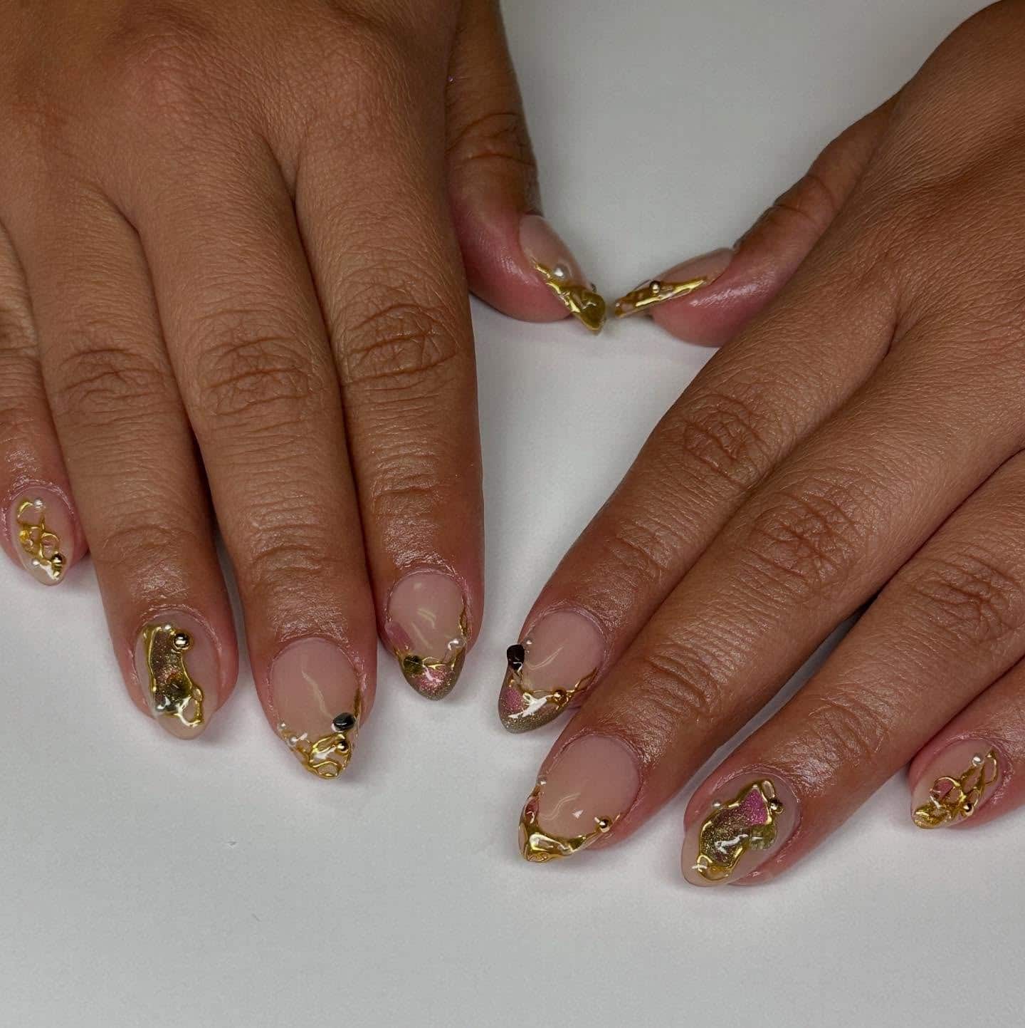 12. Abstract Gold Chrome Short Almond Nails - gold nail ideas