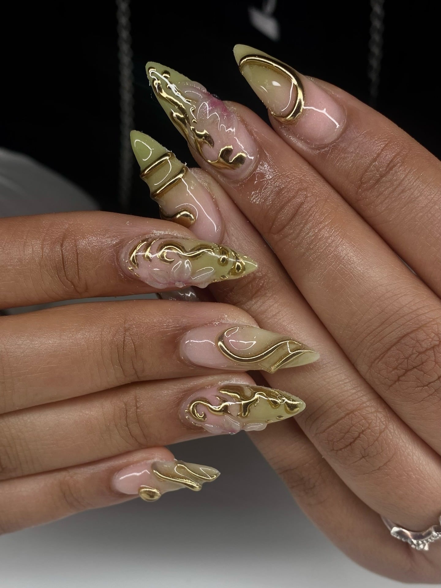 16. 3D Gold Chrome Swirl Stiletto Nails - gold nail ideas