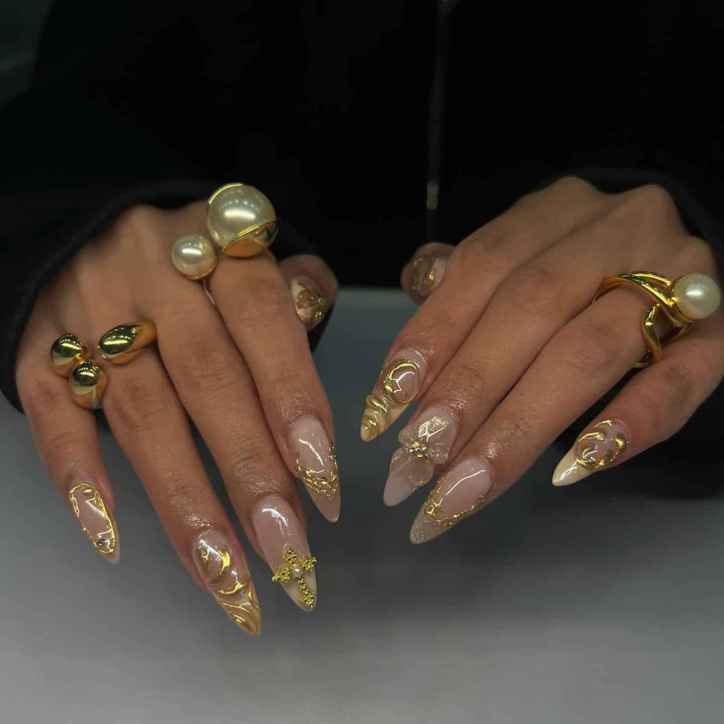 17. Luxury Gold Embellished Stiletto Nails - gold nail ideas