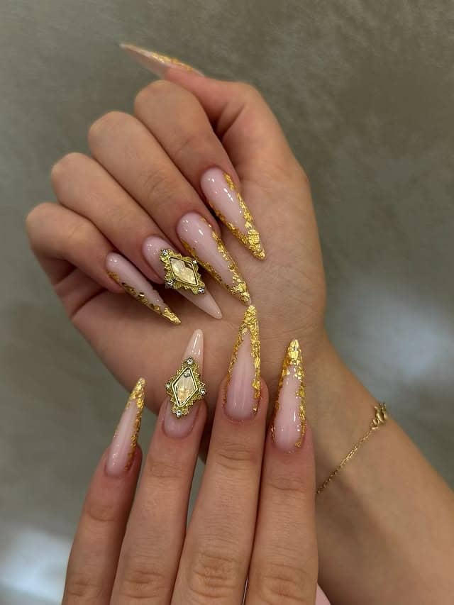 18. Gold Foil French Stiletto Nails with Crystal Charms - gold nail ideas