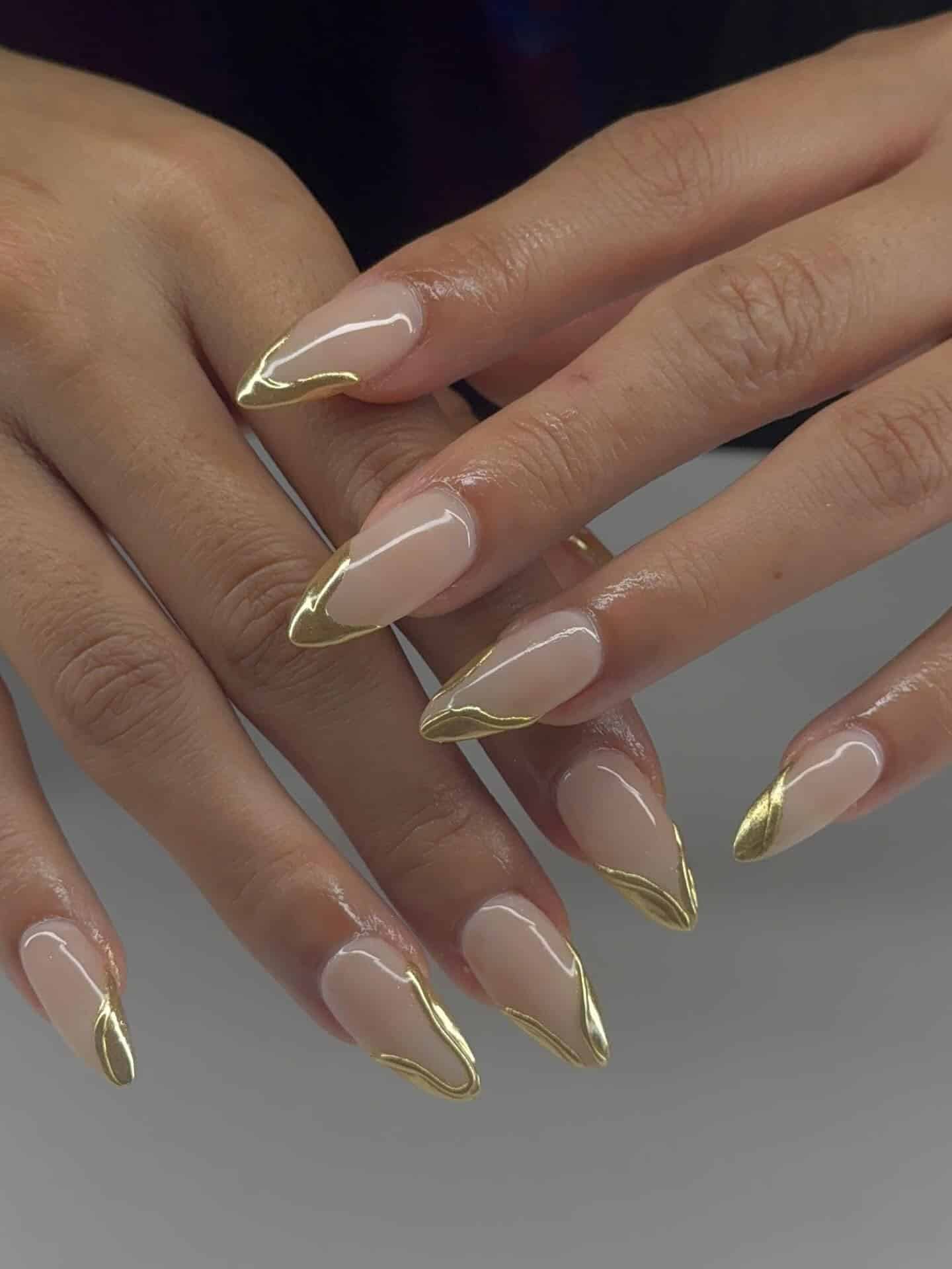 22. Nude Almond Nails with Gold Chrome French Tips - gold nail ideas