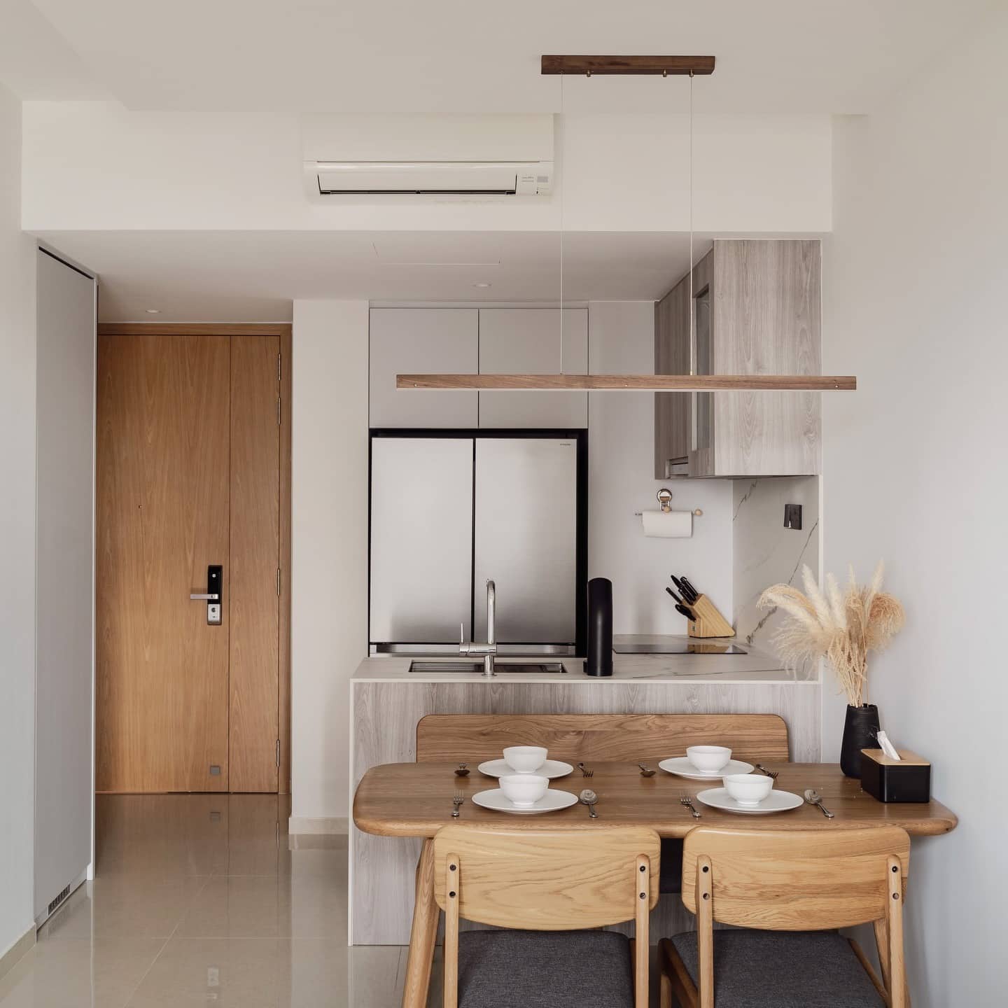 4. Minimalist Greige and Light Wood Compact Kitchen - open concept kitchen ideas
