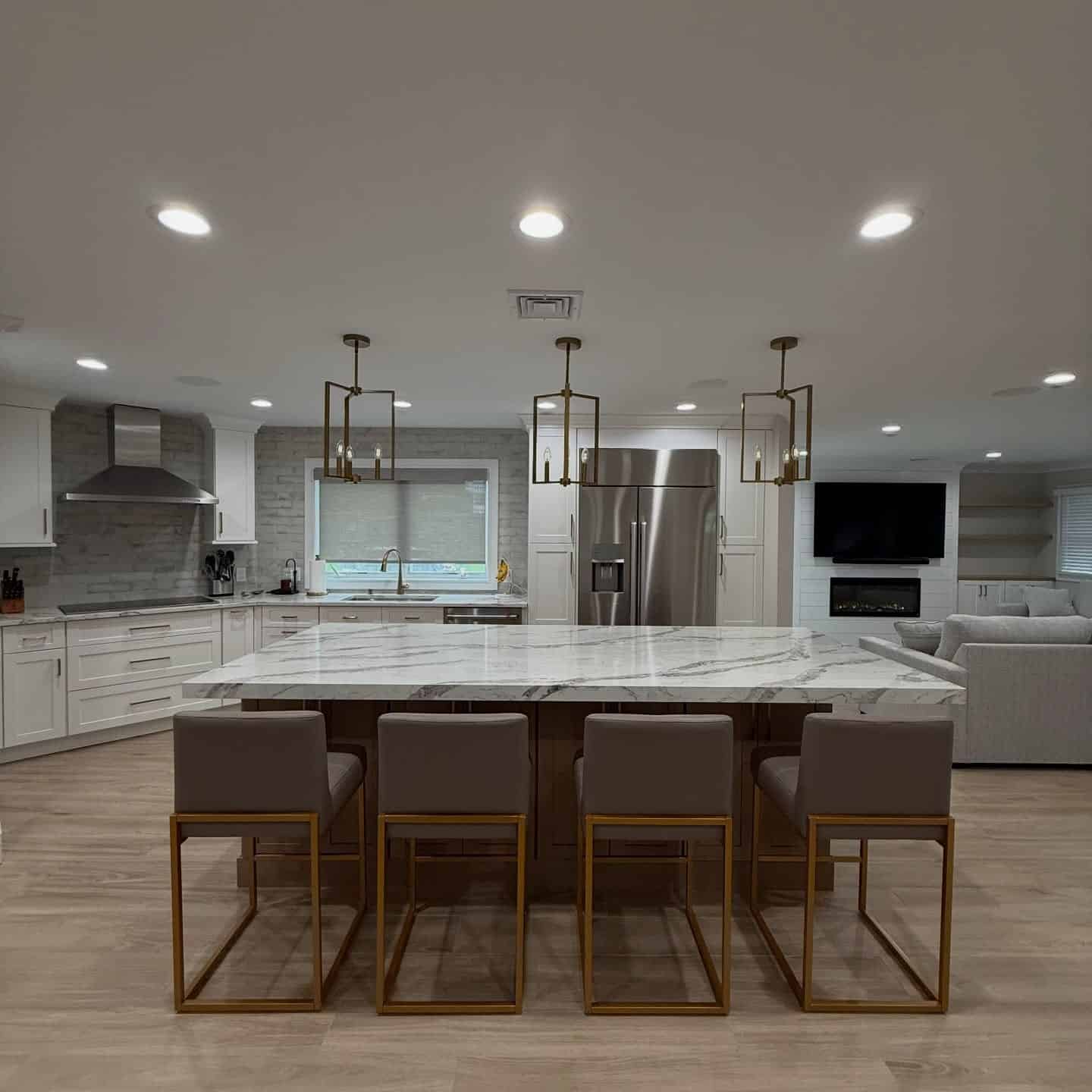 10. White, Brass, and Marble Entertaining Kitchen - open concept kitchen ideas